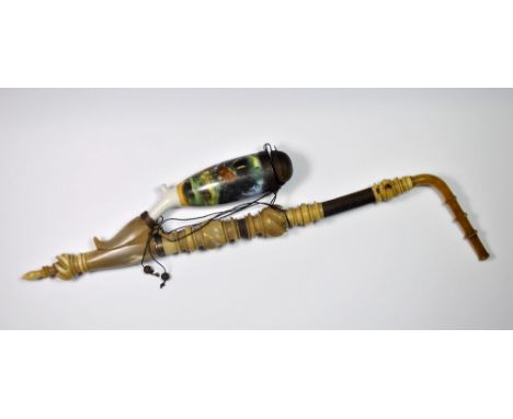An unusual Austrian turned deer horn and porcelain pipe, L. 39 cm.