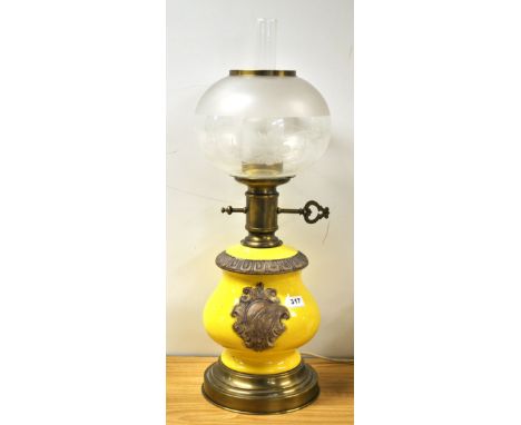 A large continental oil lamp style table lamp.