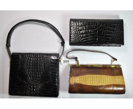 A vintage black crocodile skin hand bag (W. 22 cm) and a further skin bag.