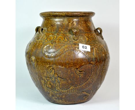 A large Chinese 18th/19th century brown glazed pottery bowl decorated with dragons, H. 31 cm.