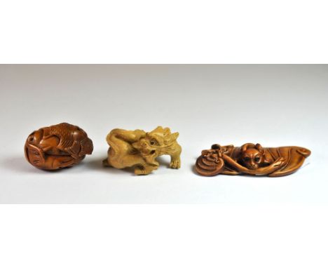 Three carved fruitwood netsuke.