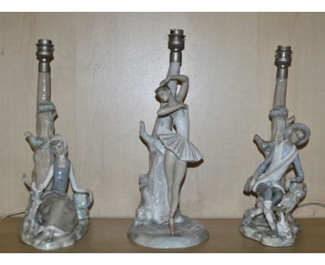 Three Lladro porcelain table lamp bases.