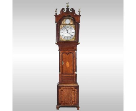 A George III oak and mahogany crossbanded cased longcase clock, with a swan neck pediment, the fourteen inch arched brass dia