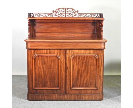 A Victorian mahogany chiffonier, with a fret carved gallery back, on a plinth base122w x 50d x 138h cm