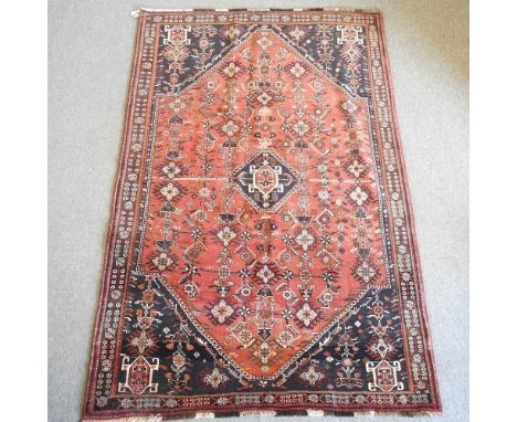 A Persian qashqai carpet, with all over medallions, 255 x 160cm