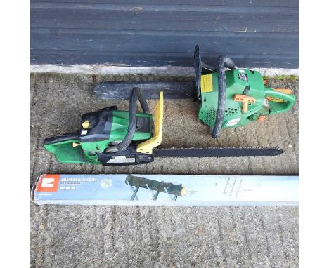 A petrol chainsaw, together with another and a chainsaw trestle (3)