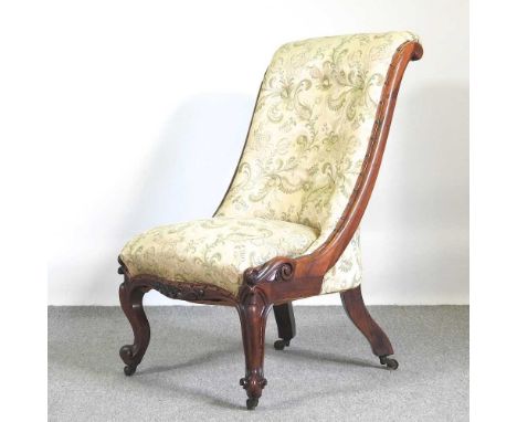 A Victorian carved rosewood button back upholstered chair95cm high