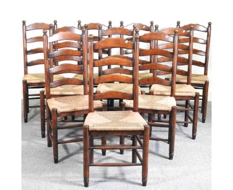 A set of ten oak ladderback dining chairs, 20th century, with rush seats, on turned legs (10)Overall condition is complete an