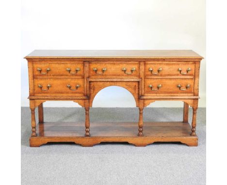 An 18th century style oak dresser base, with a pot board below153w x 46d x 82h cmOverall condition is complete and usable. It