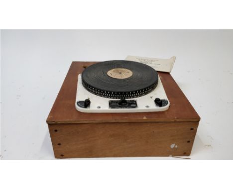 A Garrard transcription record player, model 30, on a wooden base, with the original instruction manual