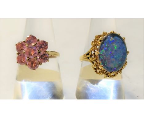 A 9 carat gold opal triplet dress ring, finger size R, 5.4 g gross; with a 9 carat gold pink stone cluster ring, 3.3 g gross;