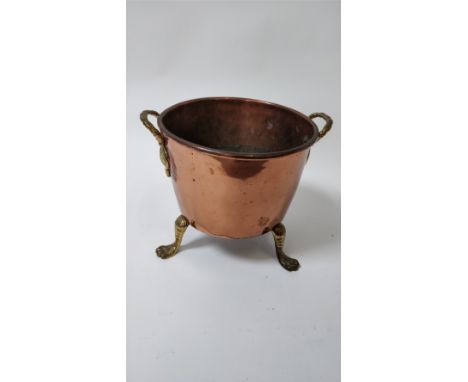 A 19th century copper coal bin, on a tripod base 32cm diameter