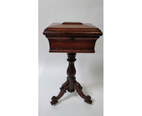 An early Victorian rosewood tea caddy on stand, with carved boarder, on a tripod base, 77cm high 