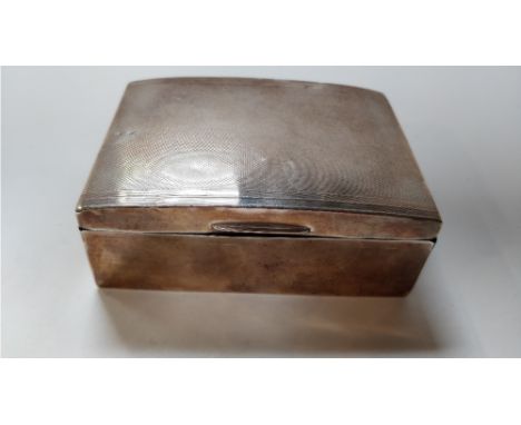 A silver cigarette box, with engine turned decoration, wooden lined, 12cm long