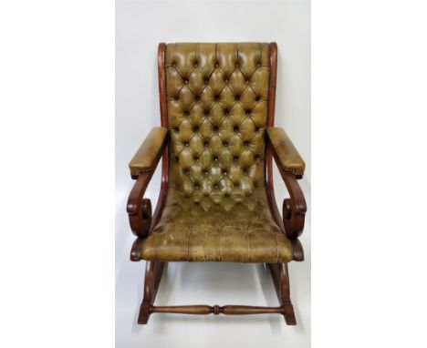 A 20th century green leather button back slipper chair