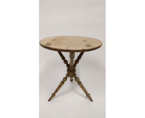 A Victorian pine cricket table, with a turned tripod base, 59cm high, 52cm diameter