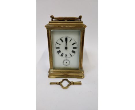 A 19th century carriage French carriage clock, with a white enamel dial and Roman numerals
