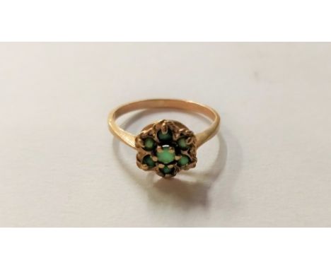 A 9 carat gold buckle ring, finger size P1/2; with a garnet cluster ring, stamped '9ct'; and a cluster ring, stamped '9ct'; 1