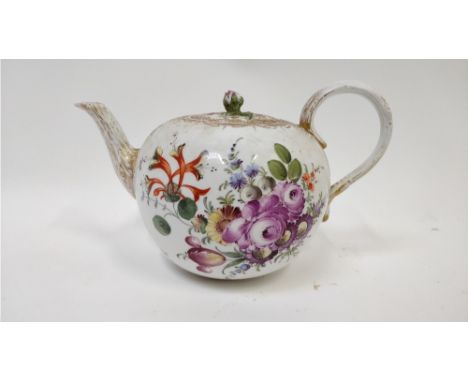 A Meissen bullet shaped teapot, decorated with sprays of flowers on a white ground, 23cm long