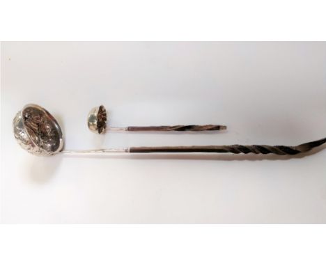 A Victorian silver cream ladle, to a bone twist handle; also a toddy ladle, the embossed coin set bowl to a bone twist handle