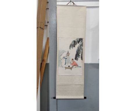 A 20th century Chinese hanging scroll, painted with a scene of boy doing calligraphy