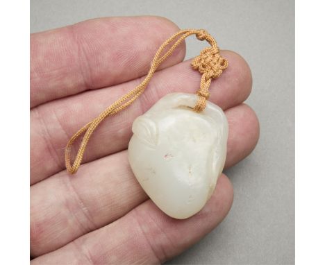 Antique Chinese jade carving in the form of a fruit or peach.Height: 1 1/2 in x width: 1 1/4 in x depth: 1/2 in. Weight: 17.4