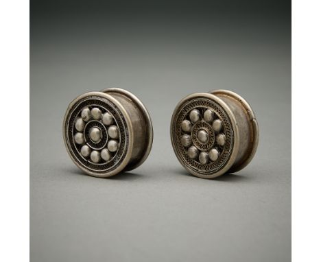 Pair of earrings from the Dong or Miao (Guizhou or Danzhai area). Of cylindrical form with fine filigree work on the front an