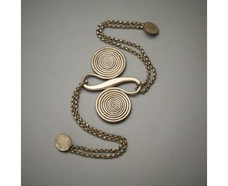 Back ornament from the Dong or Miao (Guizhou or Zhaoxing area). Comprised of a two connected spirals representing the never e