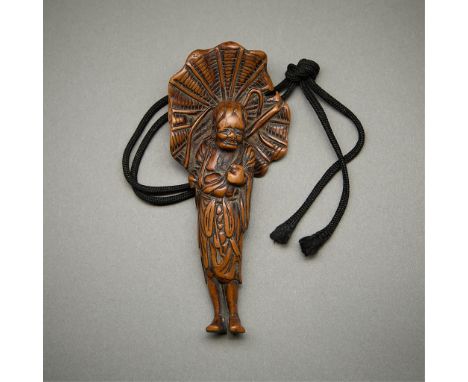 Antique Japanese figural carved wood netsuke. Carved in the form of a figure holding an umbrella.Height: 4 in x width: 2 in x