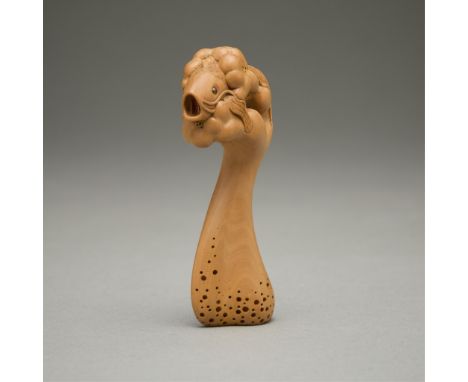 David Carlin (American, 20th-21st c). Carved boxwood netsuke titled "Leaping Carp." With inlaid eyes. With a wooden tomobako.