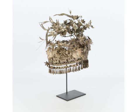 Ornate Miao headdress, potentially a bridal crown of alpaca festival crown. Comprised of a repousse metal lower register of f
