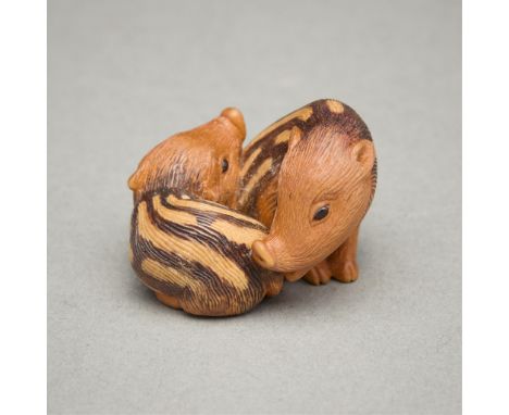 Nick Lamb (English, b. 1948). Carved boxwood with amber inlaid eyes titled "Baby Boars," completed 1995. With sumi-e detail. 