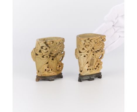 Set of two 19th century Chinese carved Qingtian or Zhejiang stone brushpots depicting dragon designs, Daoguang Period. Each i