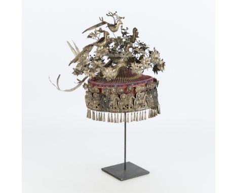 Ornate Miao headdress, potentially a bridal crown of alpaca festival crown. Comprised of a fine embroidered and pleated texti