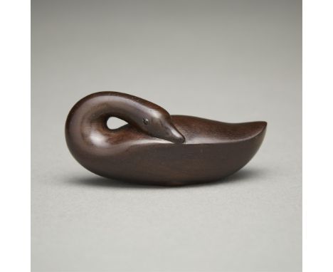 Ouchi Sosui (Japanese, 1911-1972). Carved wooden carved hakucho (swan) netsuke. Dark stained wood with inlaid horn eyes.Prove