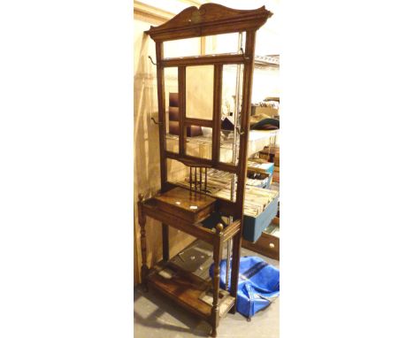 Large dark oak hallway hat and coat stand with twin stick stands and a central mirror H: 195 cm 