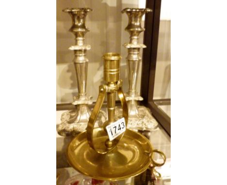 Ships rocking brass candlestick and a pair of silver plated examples 