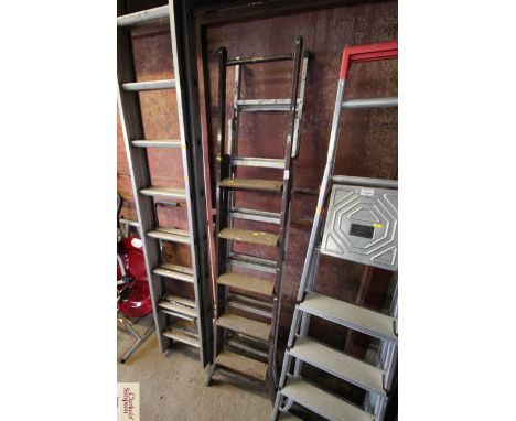 An aluminium six step folding ladder and a five step wooden and metal folding ladder