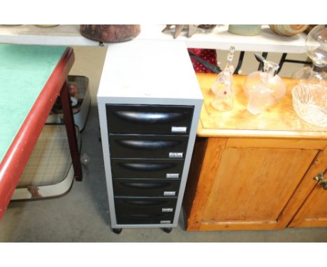 A metal and plastic chest of narrow proportions fitted six drawers