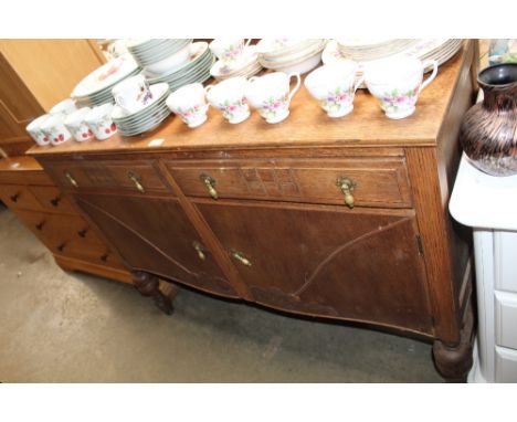 An oak sideboard fitted two drawers