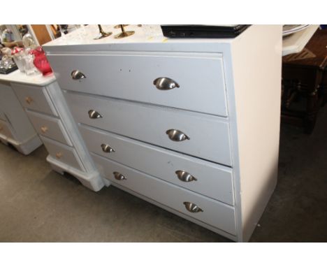 A white painted chest fitted four long drawers 