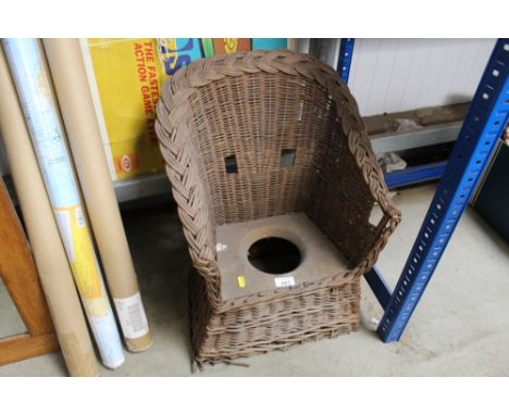 A child's wicker commode chair AF