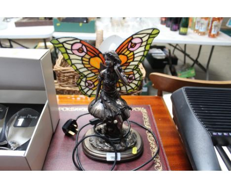 A figural decorated table lamp