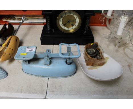 An enamelled kitchen scale and weights