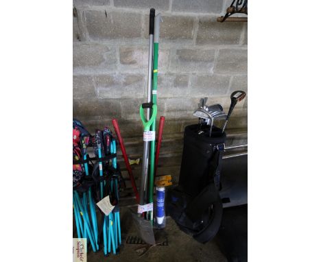 A quantity of long handled garden tools to include rake, spade, shears, drain blaster etc.