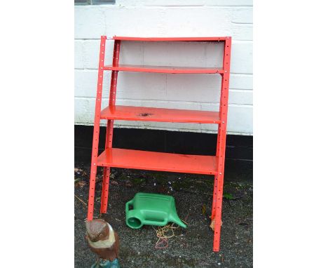 Red metal shelf unit