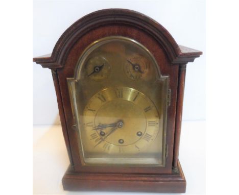 Antique wooden mantle clock with pendulumBelieved to be in full working order29 cm high x 20 cm wide 