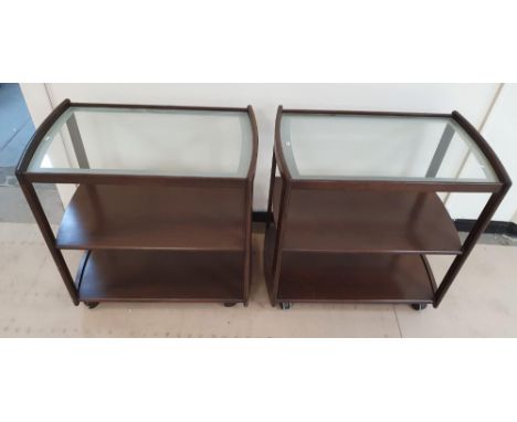 Pair of matching 20thC dark wood trollies with glassed top shelf (2),Each trolley measures 82 cm long by 50cm wide & 80cm hig