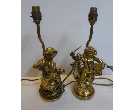 Pair of gilt metal table lamps in the form of Putti playing musical instruments (2)The putti measure 26 cm high, the total he