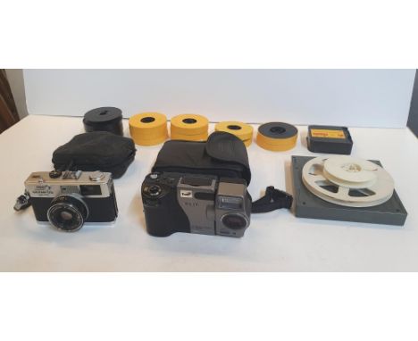 An Olympus 35 RC camera &amp; a Casio digital camera, both with cases together with tape reels etc (lot) 